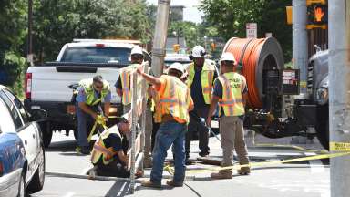 Public utilities workers setting up a barricade