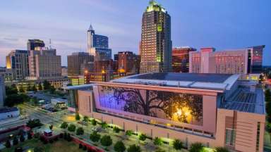 This picture shows the Raleigh Convention Center and downtown Raleigh.
