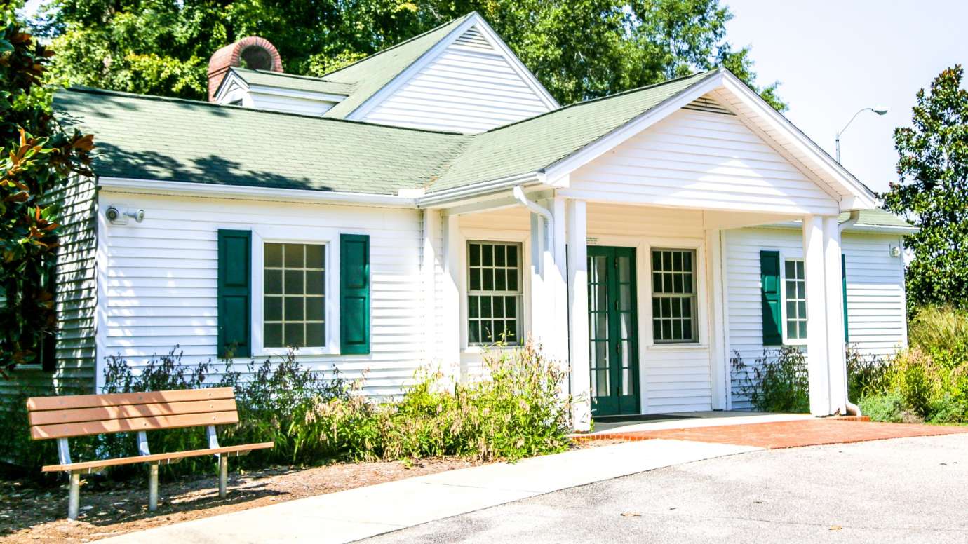 Quaint one-story cottage with shutters at Anderson Point Park