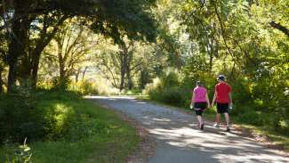 Two people walking on the greenway