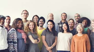 group photo of different ethnicity standing together