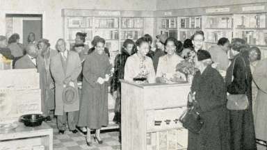old photo image of people in a store