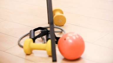 an image of an orange ball and yellow weights, and a stretch jump rope.