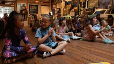 children sitting and talking to each other at the City of Raleigh museum