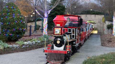 the holiday express train coming out of a tunnel