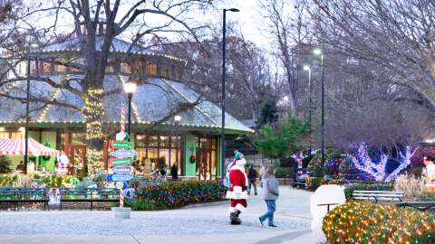 pullen park with Santa being escorted by helpers