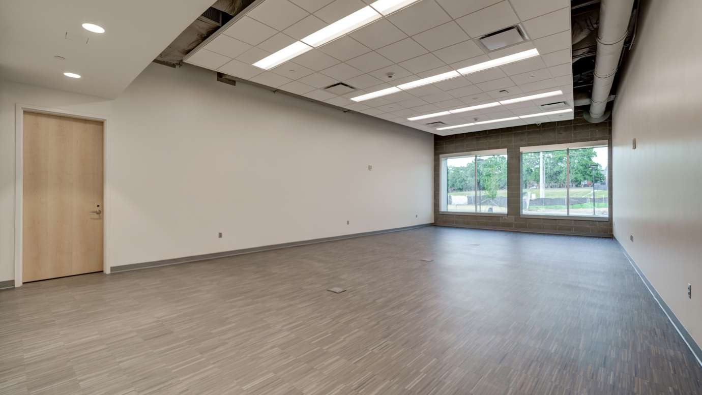 image of an empty meeting room with large windows