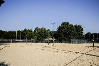 Six outdoor sand volleyball courts with lighting