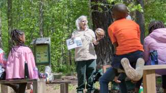 Nature instructor leading a school group program at Durant Nature Preserve